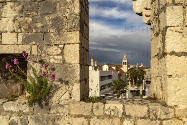 View through the battlements of Kamerlengo Fortress to the old town centre of Trogir, Croatia,