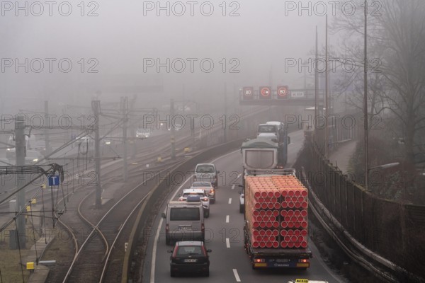 Dense fog, with visibility sometimes less than 100 metres, A40 motorway, city passage in Essen,