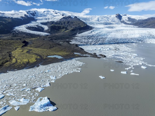 Aerial view over the glacial lake Fjallsárlón, glacier Fjallsjökull, part of Vatnajökull glacier,