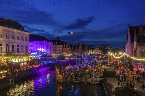 Visitors on grandstand at the Graslei watching Pole Pole podium during Gentse Feesten, Ghent city