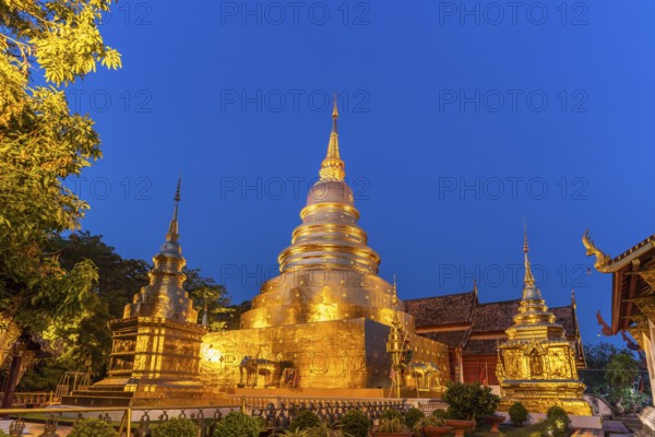 Golden Chedi Phrathatluang of the Buddhist temple complex Wat Phra Singh at dusk, Chiang Mai,