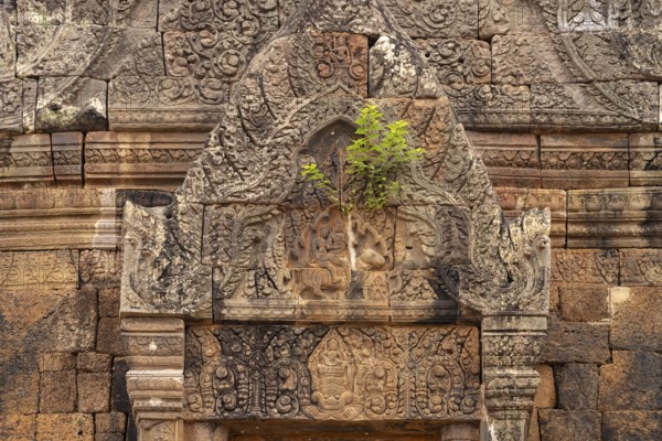 Relief with Shiva and Parvati on the bull Nandi above the false door of the mountain temple Wat