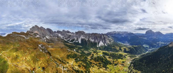 Dark clouds over the Geisler and Puez Group, wide-angle panoramic shot, drone shot, Val Gardena,