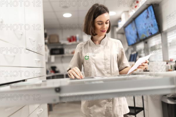 Female pharmacist searching for supplies in the storage room of the pharmacy store