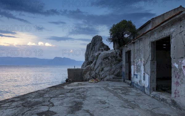 Lost place, dilapidated building by the sea in a quiet evening mood, Peljesac, Neretva, Croatia,