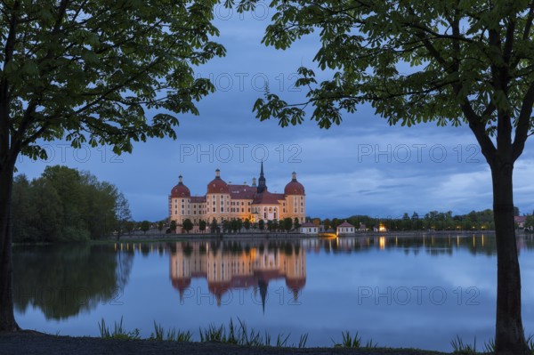 Moritzburg Hunting Lodge with reflection in the castle pond in the evening, Moritzburg, Saxony,