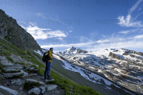 Mountaineer in front of high alpine mountain landscape, summit of the Aiguille de Chardonnet and