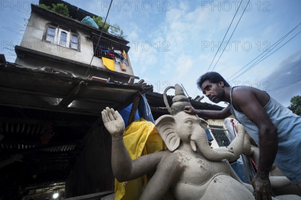 Guwahati, India. 4 September 2024. Artisan work on idols of the elephant-headed Hindu deity Ganesha