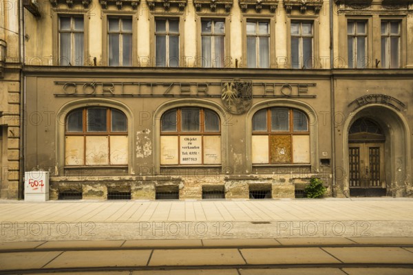 Facade of an old closed hotel, Goerlitzer Hof, in need of renovation, GDR architecture, city
