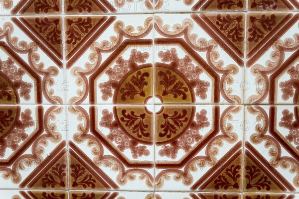 Traditional ceramic tiles with red and brown decorative pattern, Azulejos, Portugal, Europe