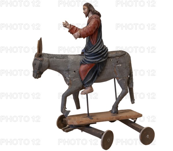 Christ on the palm donkey, on a white background, wooden figure from around 1400, Museum Bezau,