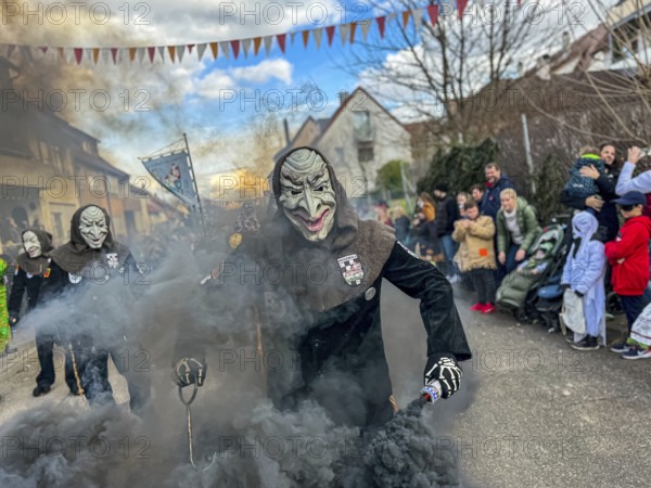 Hofener Hogamale with smoke bomb at the big carnival parade of the Hofener Scillamännle, Hofen,