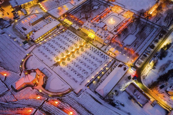 Aerial view of Wackerbarth Castle with castle park, belvedere and vineyards with snow and Christmas