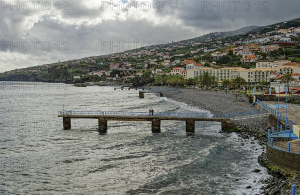 Promenade in rainy weather on the beach of the Atlantic Ocean, municipality of Santa Cruz, Madeira,