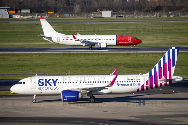 Sky Express Airbus A320 and Norwegian Boeing 737, aircraft after landing at Düsseldorf Airport,