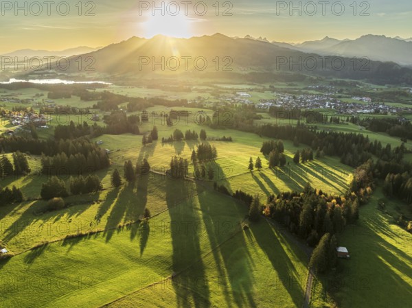 Mountain range near village Wertach, view to lake Gruentensee and village Wertach, sunrise, autumn
