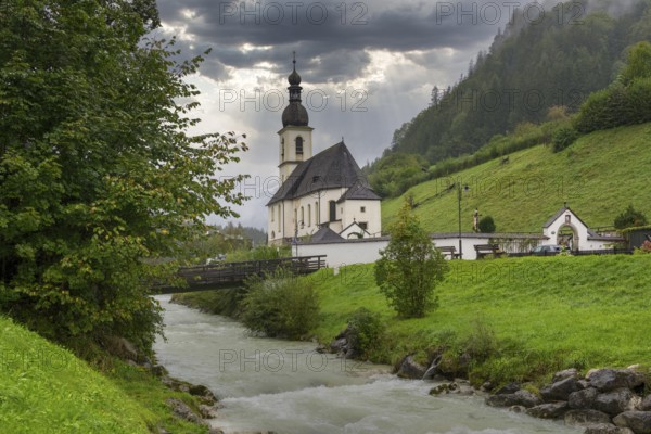 Parish church of St Sebastian, bridge, stream, rainy weather, Ramsauer Ache, Ramsau,