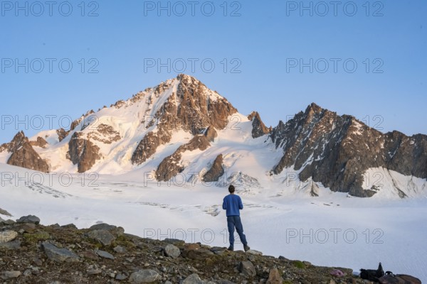 High alpine mountain landscape at sunset, Glacier du Tour, mountaineer in front of glacier and