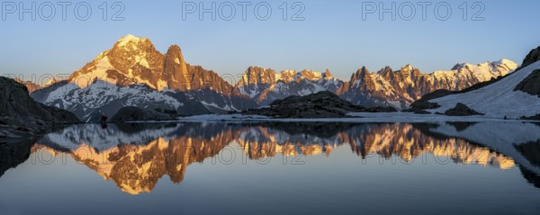 Evening mood, mountain landscape at sunset, alpenglow, water reflection in Lac Blanc, mountain