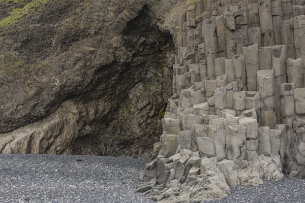 Reynisfjara Beach with Basalt rocks (Stuolabrrg) and the rock needles (Haidrangur), close to Vik i