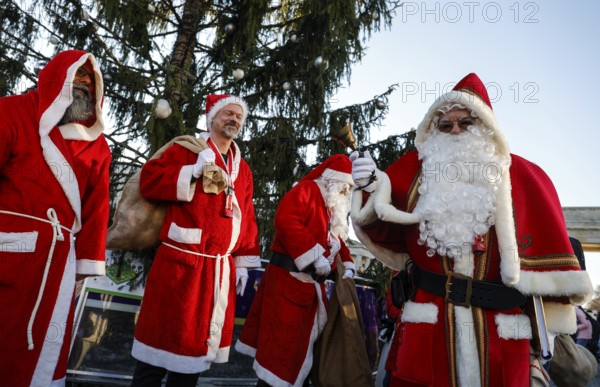 Assembly of Santas and angels of the Berlin Father Christmas Centre at the Brandenburg Tor, Berlin,