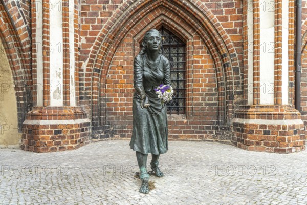 Grete-Minde monument in front of the historic town hall in Tangermünde, Saxony-Anhalt, Germany,