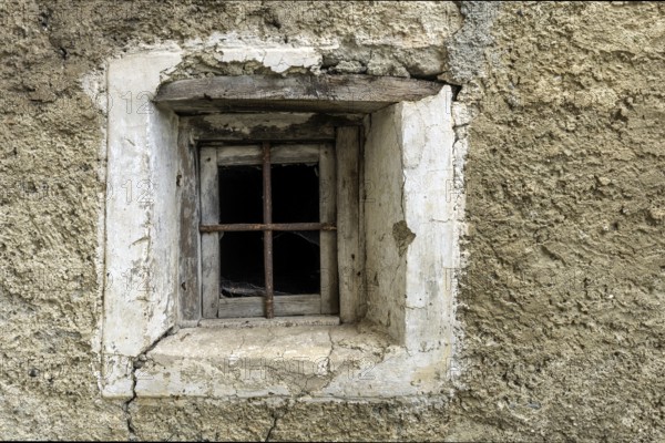 Dilapidated window of an old house in the mountain village of Bordei, Centovalli, Canton Ticino,
