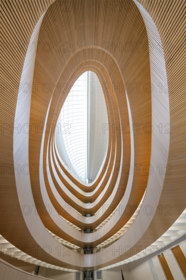 Futuristic interior design with spiral-shaped wooden structures and glass roof, UB- Recht, Zurich,