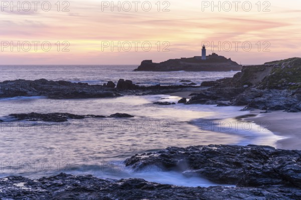 Godrevy Lighthouse, the lighthouse of Godrevy on Godrevy Island. In the evening at sunset. Long