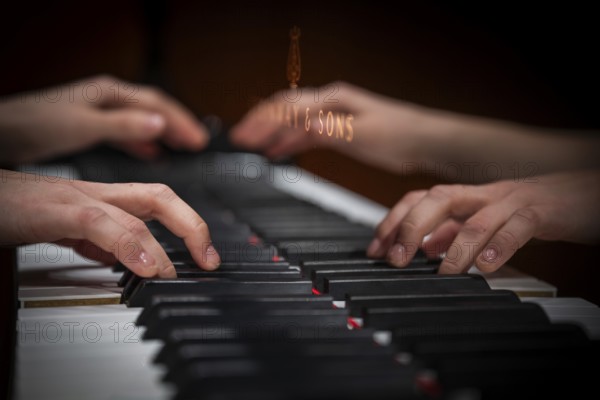 Hands of a young pianist playing on the keyboard of a Steinway & Sons grand piano, Stuttgart,