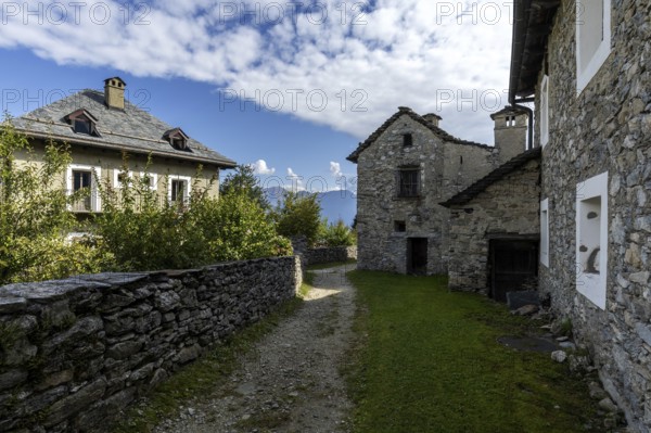View of the village, typical Ticino stone houses in the mountain village of Rasa, Centovalli,