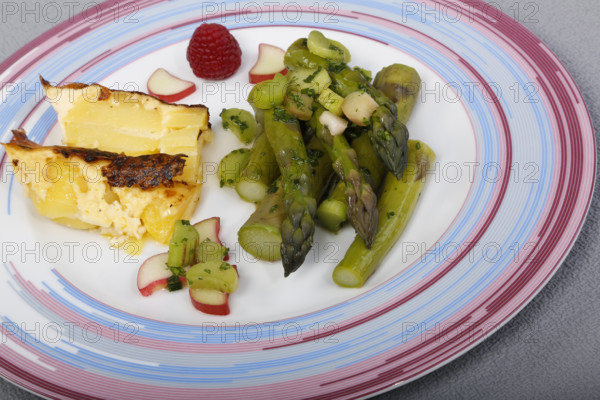 South German cuisine, green asparagus with rhubarb vinaigrette and potato gratin, healthy,