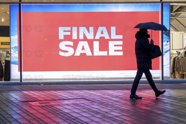 Final Sale, Clothing department stores' on Schadowstraße, large poster in the shop window