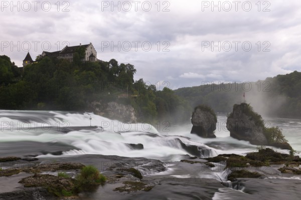 Majestic waterfall with castle in the background, Schloss Laufen, Rhine Falls, Canton Schaffhausen,
