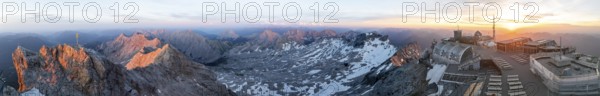 Sunset, Alpine panorama, aerial view, Zugspitze with summit cross, Zugspitzbahn and Zugspitzplatt