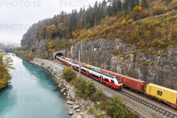 Train of the S-Bahn Vorarlberg and goods train of the Austrian Federal Railways ÖBB Eisenbahn in