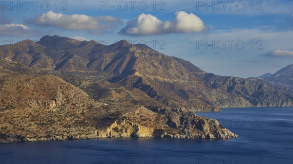 Mountains and sea under a cloudy sky, morning light, sunrise, coastal road, east coast, Karpathos,