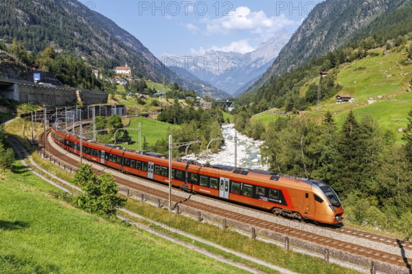 Railway passenger train of the type Stadler Flirt of the Südostbahn on the Gotthard railway in the