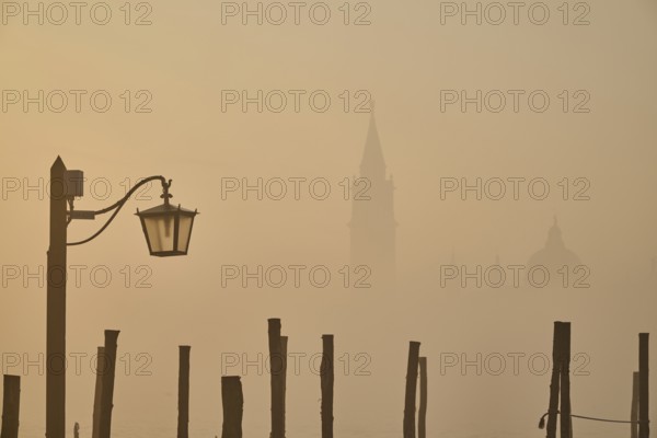 View from 'Colonna di San Marco e San Teodoro' on church 'Giorgio Maggiore' on a foggy morning at