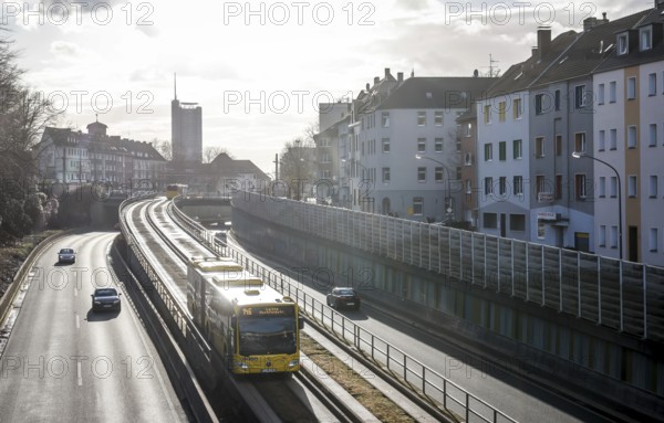 Essen, North Rhine-Westphalia, Germany - Cars and a public bus drive on the A40 motorway through