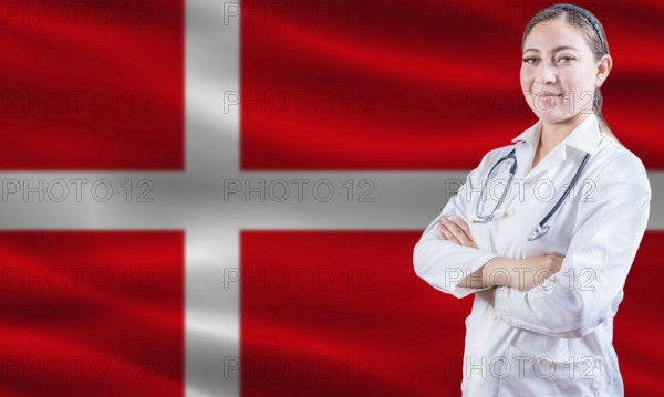 Female doctor on danish flag. Doctor with crossed arms on danish flag. Denmark health and care