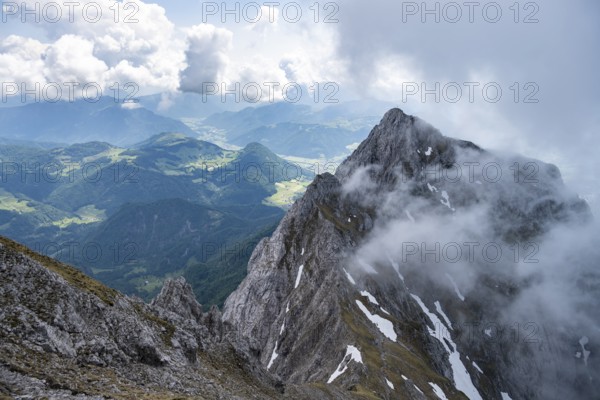 Mountain landscape, low view during the ascent to the Maukspitze, clouds moving around the