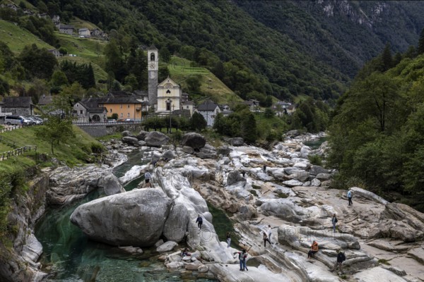 People on rocks on the Verzasca, behind Lavertezzo, Verzasca Valley, Valle Verzasca, Canton Ticino,