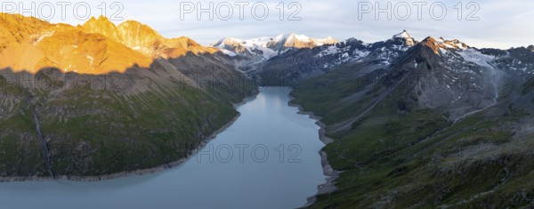 Alpine panorama with Pigne d'Arolla, Lac de Dix, sunset in the mountains, reservoir, Valais Alps,