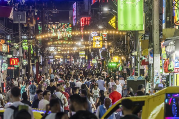 Crowds of people on Bangla Street in the evening. Nightlife on Bangla Walking Street with go-go