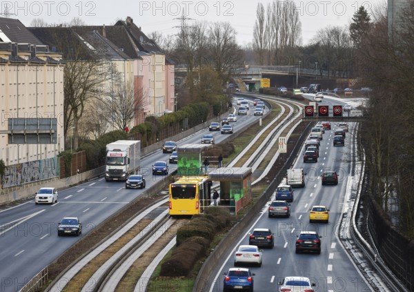 Essen, North Rhine-Westphalia, Germany - Cars and a public bus drive through Essen city centre on