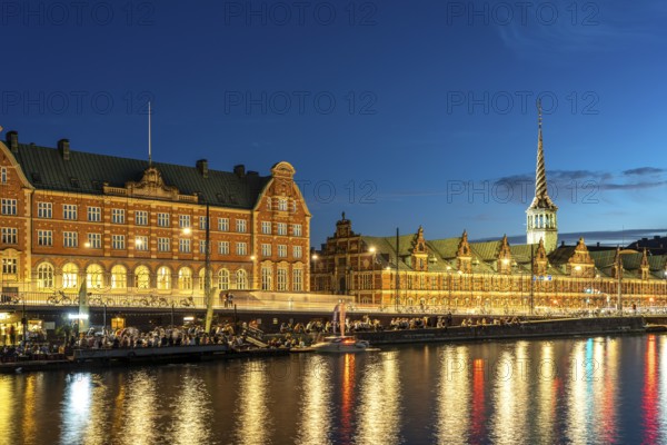 The former stock exchange Børsen and C.F. Tietgens Hus on Holmens Canal at dusk, Copenhagen,