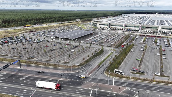 Tesla Giga Factory on the A10 motorway, in the centre of the picture is a photovoltaic system above