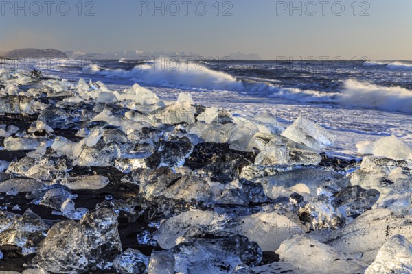 Ice floes on the beach, waves, sea, sunny, morning light, winter, Diamond Beach,