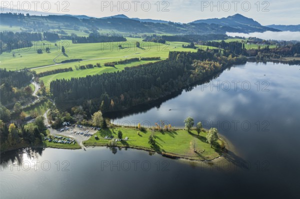 Sports facility and bathing area, lake Rottachsee, at village Petersthal, mt. Gruenten in the back,